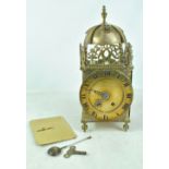 A 20th century brass lantern clock, the dial inscribed 'Edward East', height 38cm.