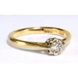 An 18ct yellow gold diamond solitaire ring with round brilliant cut illusion set stone, size M,