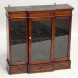 A mahogany hanging cabinet of breakfront outline with glazed central door and base set with three