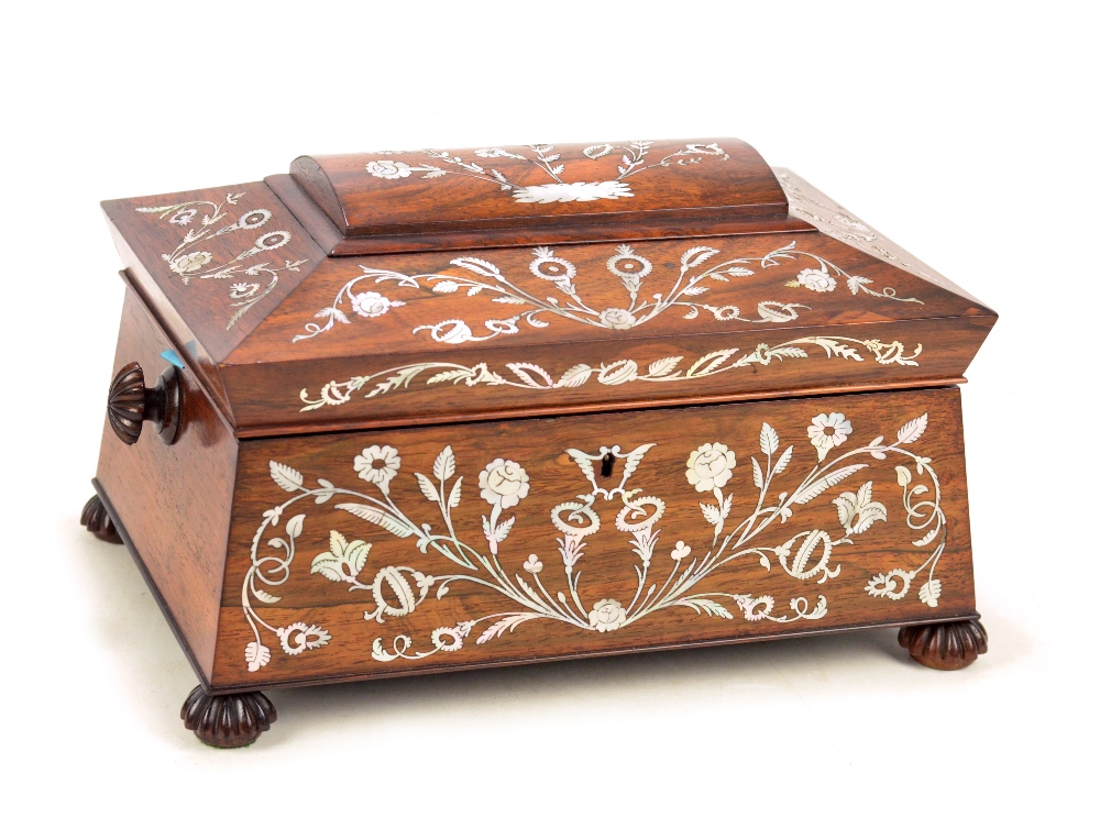 A good early Victorian rosewood and mother of pearl inlaid sewing box of large sarcophagus form,
