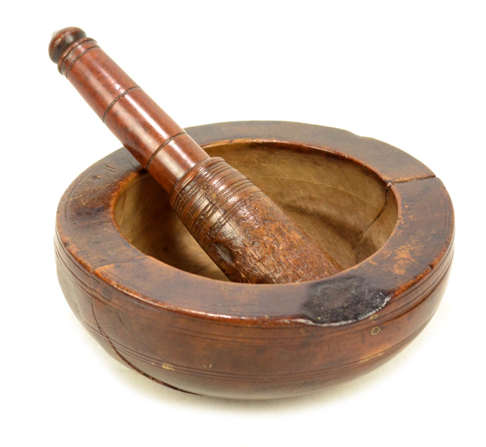 A good late 18th/early 19th century yew wood and fruitwood pestle and mortar,