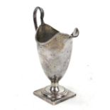 SPINK & SON; a Victorian hallmarked silver helmet cream jug with beaded rim,