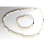 A single string cultured freshwater pearl necklace with white metal clasp stamped 375, length 46cm,