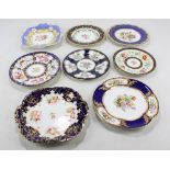 Seven Coalport floral painted cabinet plates with gilt heightening and blue borders and a similar
