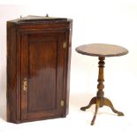 A 19th century oak corner cupboard with single door enclosing two shelves and single drawer,