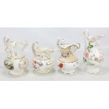 Four Coalport inscribed jugs, the first painted with floral sprays inscribed 'William Plant 1848',