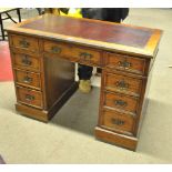 A mahogany twin pedestal desk with inset leatherette top, width 96.5cm.