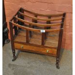 A late 19th century mahogany Canterbury with four slatted divisions above a single drawer raised on