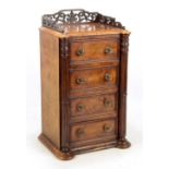 A mid-Victorian figured walnut miniature chest of drawers,