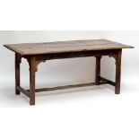 An early 19th century oak refectory table of small proportions,