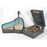 A cased banjolele and a May-Fair 'DeLuxe Model' portable gramophone (2).