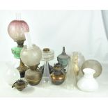 A group of lamps and lamp fittings including a floral painted Victorian lamp,