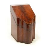 A George III mahogany and chevron strung knife box of serpentine outline with hinged lid,
