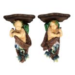 An exceptionally rare pair of Minton majolica wall brackets designed by Albert Carrier Belleuse,