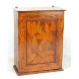 An Edwardian stained beech and stencil decorated wall cabinet,