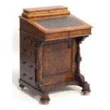 A Victorian figured walnut and inlaid Davenport,