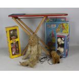 A mixed group of toys including Merrythought monkey, bear hand puppet,