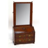 A good early 18th century walnut toilet mirror,