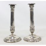 A pair of early 19th century Italian silver candlesticks with ornamental acanthus leaf sconces