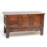 A George III oak blanket chest, with single drawer to base and raised on stile supports,