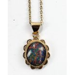 A 9ct yellow gold mounted opal pendant on yellow metal chain stamped 9ct to loop, chain length 54cm,