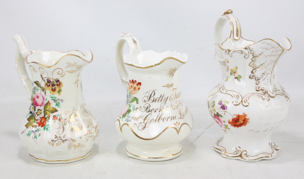 Three Coalport floral painted inscribed jugs, 'Betty Turner Born Nov 2nd 1829 at Golborne,