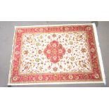 A beige ground Keshan carpet, 280 x 200cm.