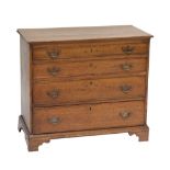 A George III oak chest of four long graduated drawers raised on bracket feet, height 75cm,