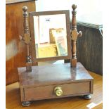 A small 19th century mahogany swing toilet mirror with rectangular plate held in ring turned