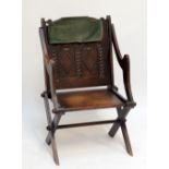 An oak Glastonbury chair with carved detail to back.