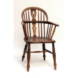 A 19th century ash and elm low hoop back Windsor elbow chair.