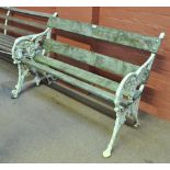 A white painted cast iron garden bench, width approx 122cm.