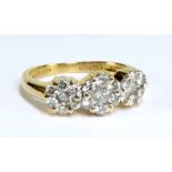 An 18ct yellow gold and diamond cluster ring in a three daisy arrangement, size J 1/2, approx 3.0g.