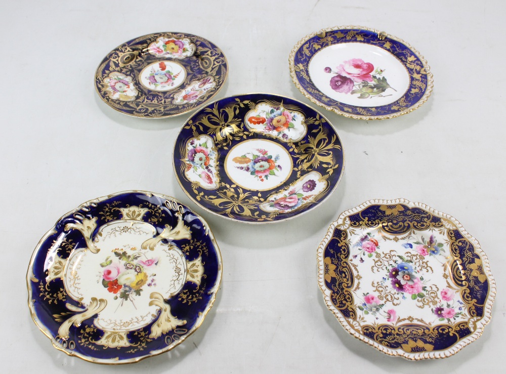 Five Coalport floral decorated gilt heightened cabinet plates with dark blue borders,