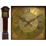 An early 19th century oak cased longcase clock with domed pediment and rectangular plinth base,