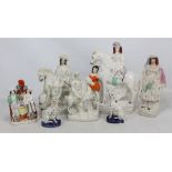 A group of Staffordshire figures including a pair of Dalmatians and a figural spill vase (several