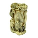 A late 19th/early 20th century Chinese ivory carving with suspension ring modelled as the twelve