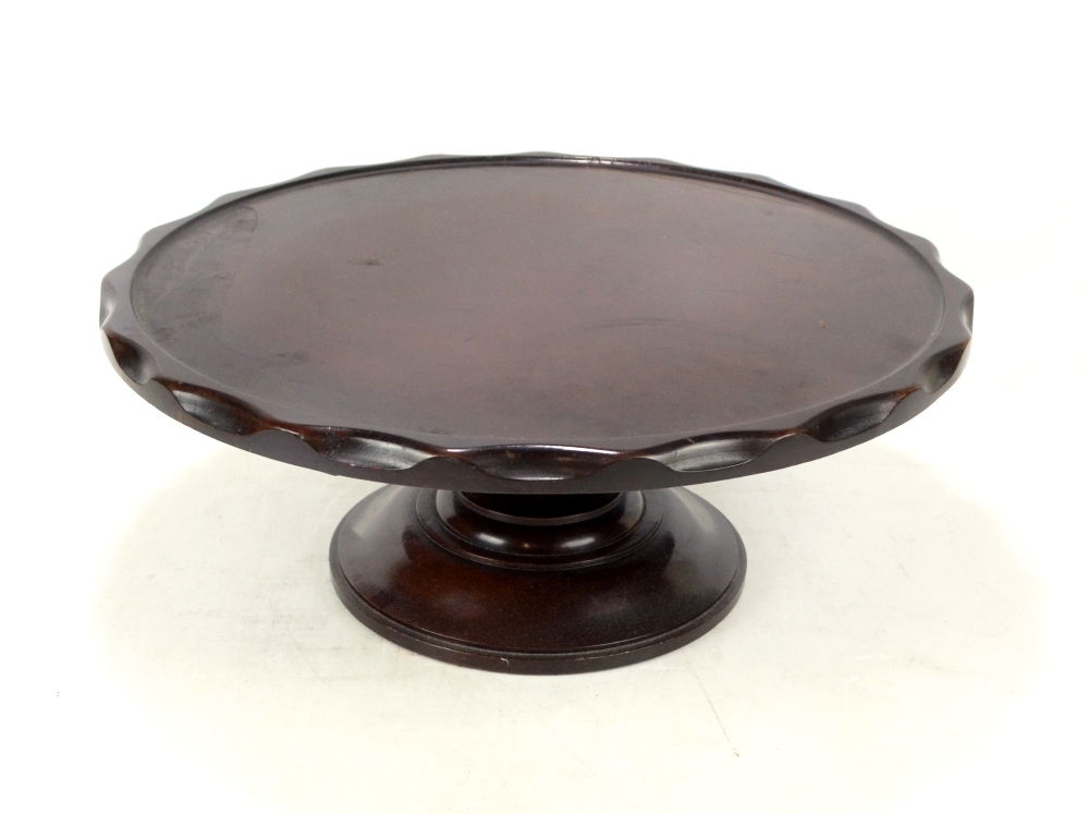 A late Victorian/Edwardian mahogany Lazy Susan, with spinning shaped circular top,