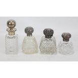 Four hallmarked silver topped clear cut glass scent bottles to include a square sectioned example,