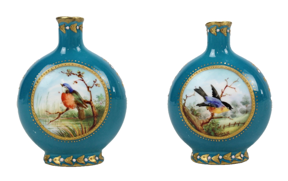 A small Coalport turquoise ground gilt heightened vase decorated with twin circular panels,
