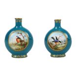 A small Coalport turquoise ground gilt heightened vase decorated with twin circular panels,