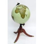 A 1970s/80s 24" terrestrial globe, undetailed but with raised geographical detail,