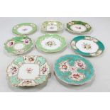 Eight Coalport floral painted gilt heightened green ground cabinet plates and dishes of various