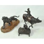 Three Oriental bronze studies comprising roaring tiger with character mark to base,