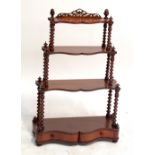 A set of Victorian mahogany graduated hanging wall shelves of serpentine outline with bobbin turned