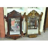 Two late 19th century fretwork wall mirrors in the Georgian taste, each approx 76cm.