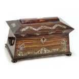 An early Victorian coromandel and mother of pearl inlaid tea caddy of sarcophagus form,