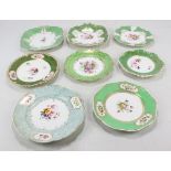 Eight Coalport floral painted gilt heightened green ground cabinet plates and dishes of various