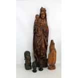 A wooden flat back carving of Madonna and Child 'In Glory', height 74cm, three African ebony head