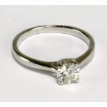 A platinum and diamond solitaire ring, the round brilliant cut stone weighing 0.61ct, colour F,